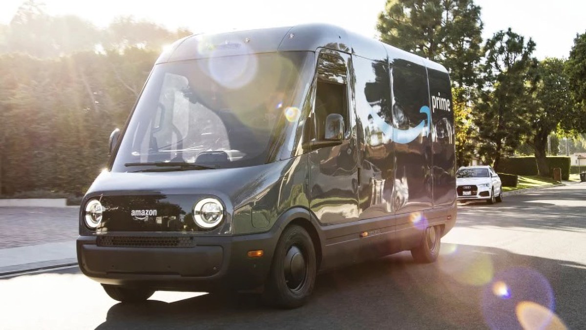 A navy blue electric Amazon delivery van manufactured by Rivian. It was recently revealed that Amazon owns almost 150 million shares of Rivian stock