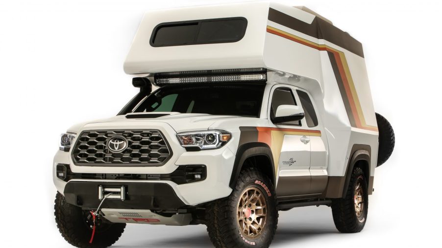 This is a promotional photo of Toyota's in-house Tacozilla custom Tacoma. The truck has a full camper instead of a bed, inspired by old Chinook campers. The Toyota Tacoma took home the mid-size SEMA truck of the year award. | Toyota