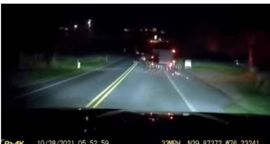 Amish horse and buggy drifting across two lanes of traffic