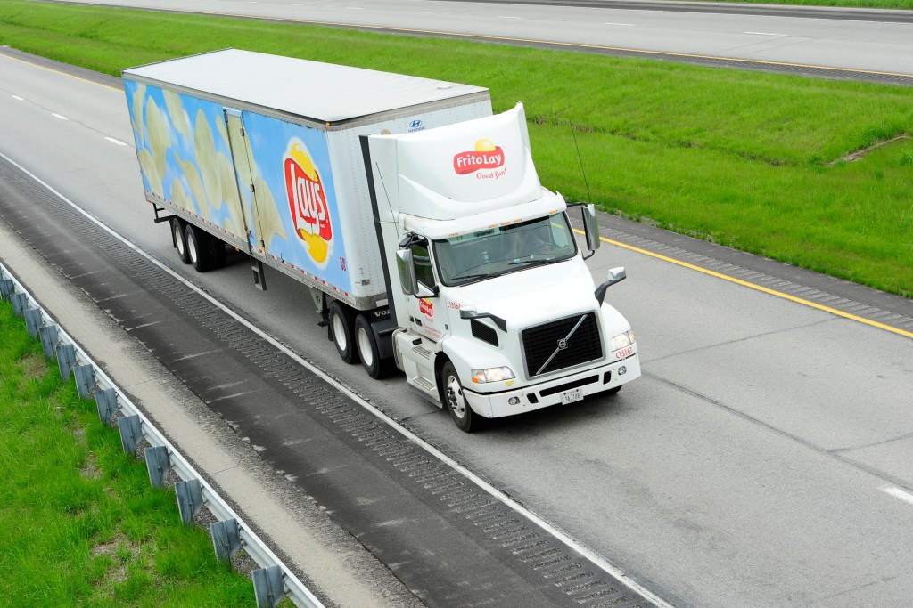 Semi-truck driving down highway