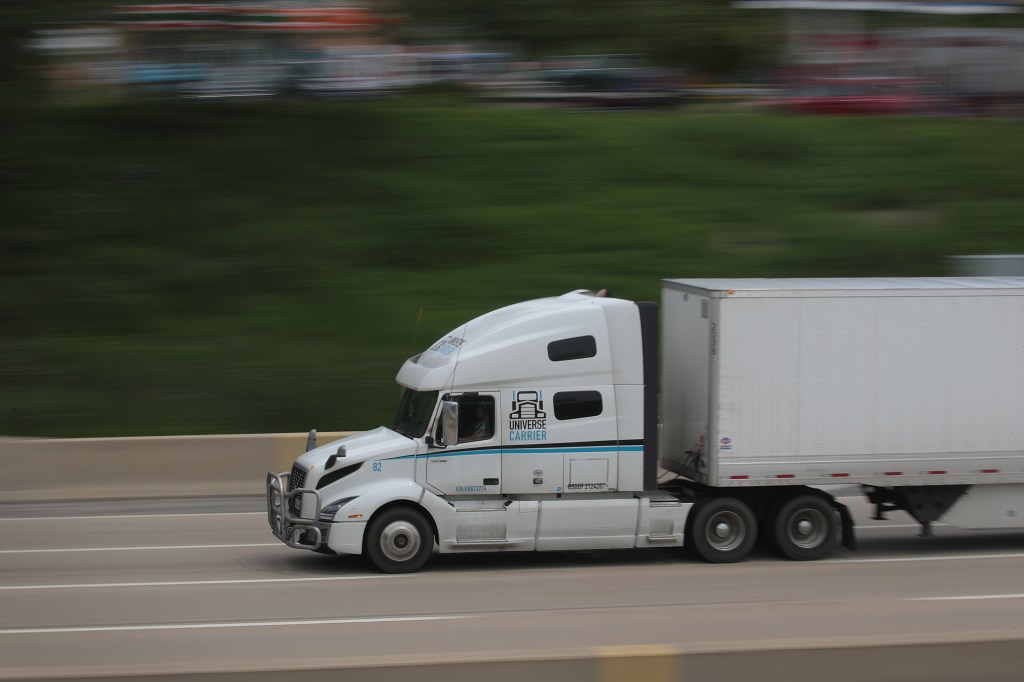 Semi-truck speeding down the highway