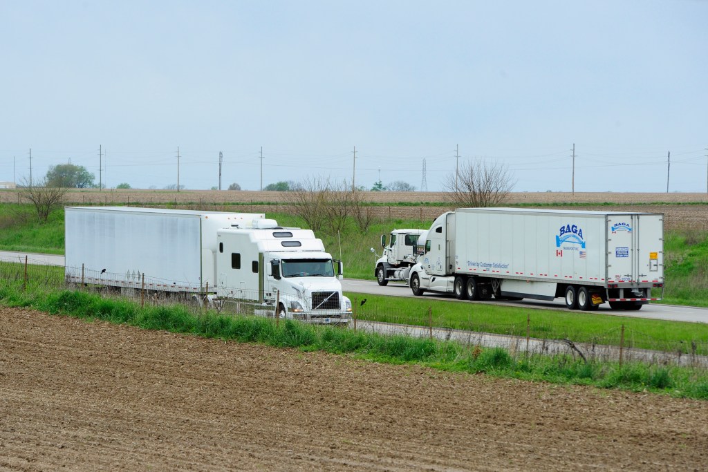 Semi trucks driving on highway