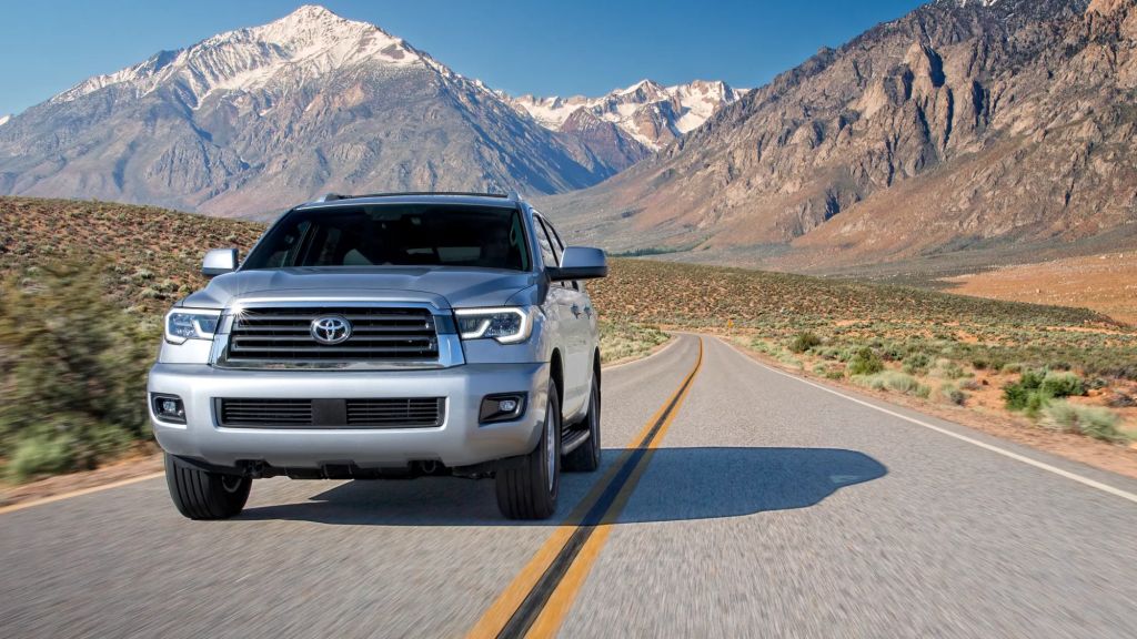 Silver 2022 Toyota Sequoia, a good SUV for sleep, with mountains in the background