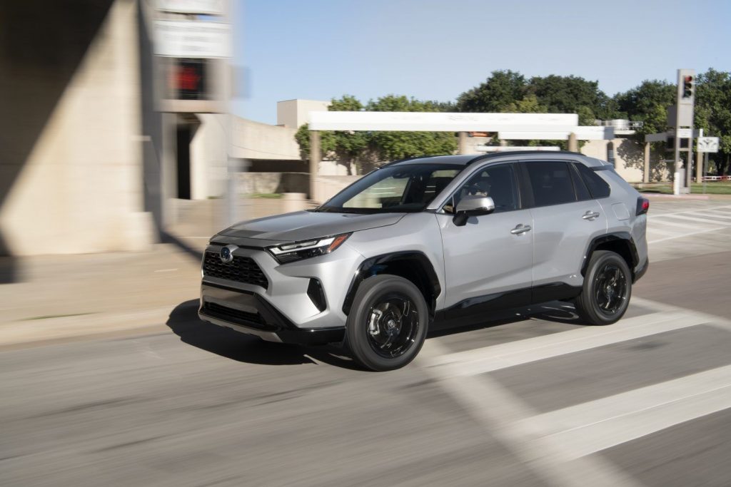 Silver Sky Metallic 2022 Toyota RAV4 driving on a street