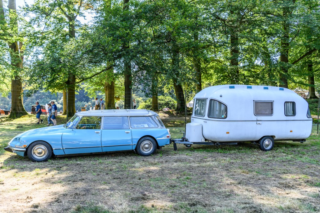 Station wagon pulling vintage camper. Some cars and suvs are some of the best towing vehicles that aren't trucks.