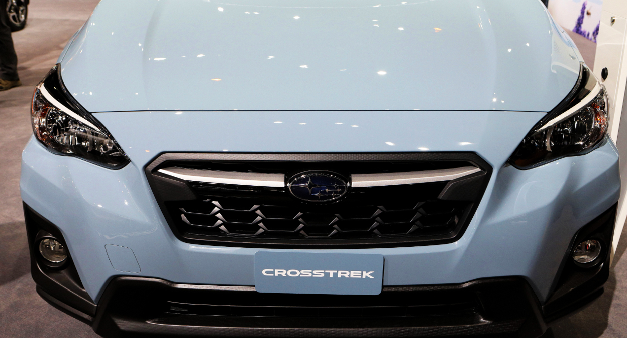 A blue Subaru Crosstrek is on display.