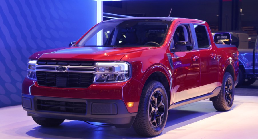 A red 2022 Ford Maverick is on display.
