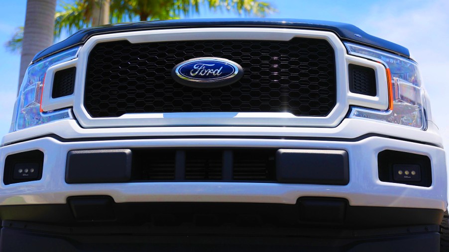 The front of a white Ford F-150 pickup truck.