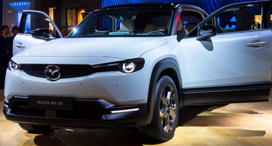 A gray Mazda MX-30 electric SUV is on display.