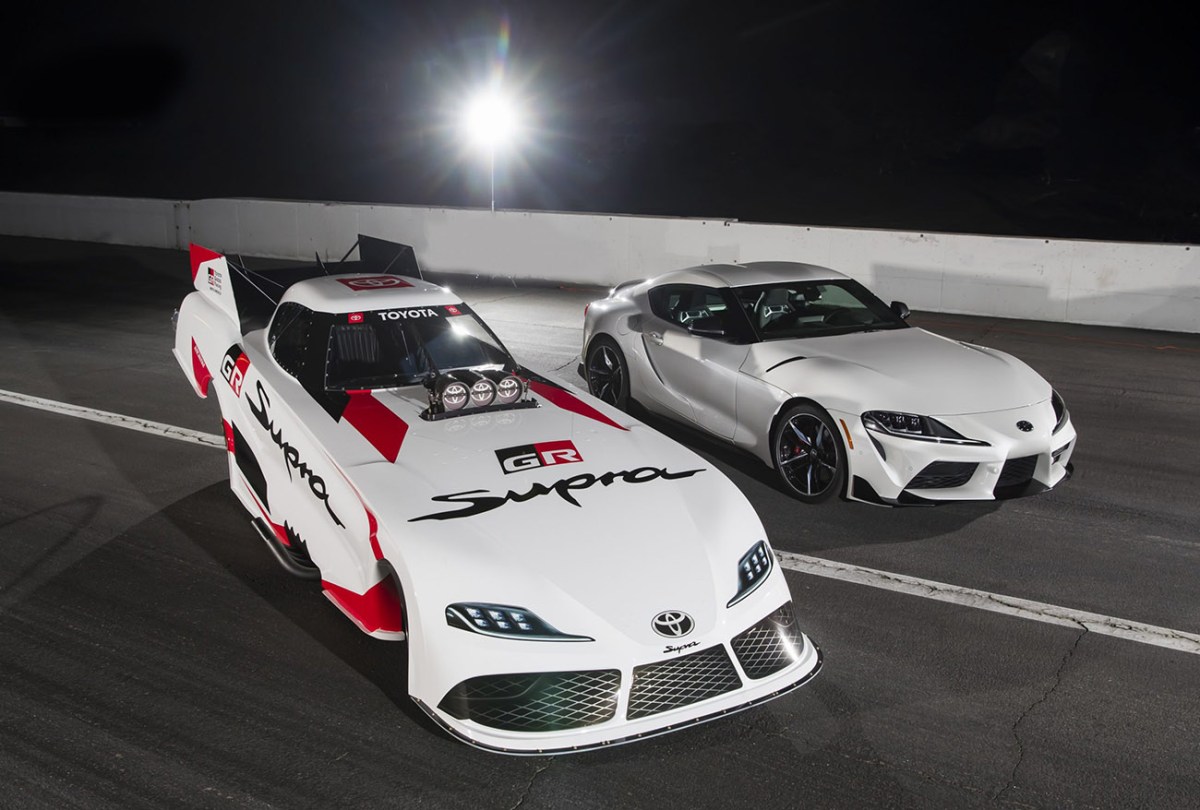 Toyota GR Supra NHRA Funny Car parked next to a standard production Toyota GR Supra