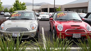 Used cars are displayed on a sales lot .