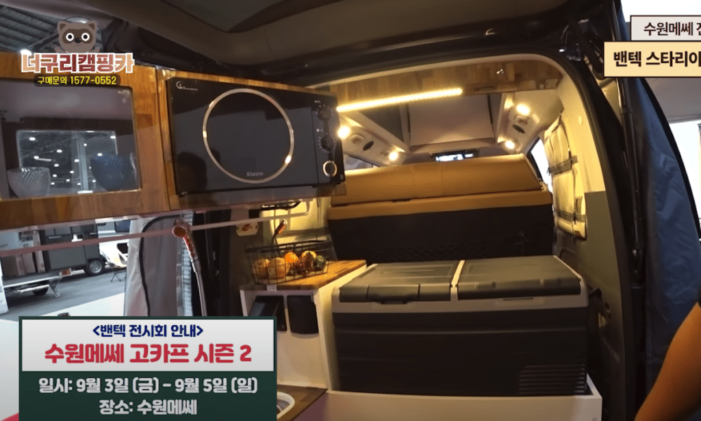 Flip out microwave in the Hyundai camper van
