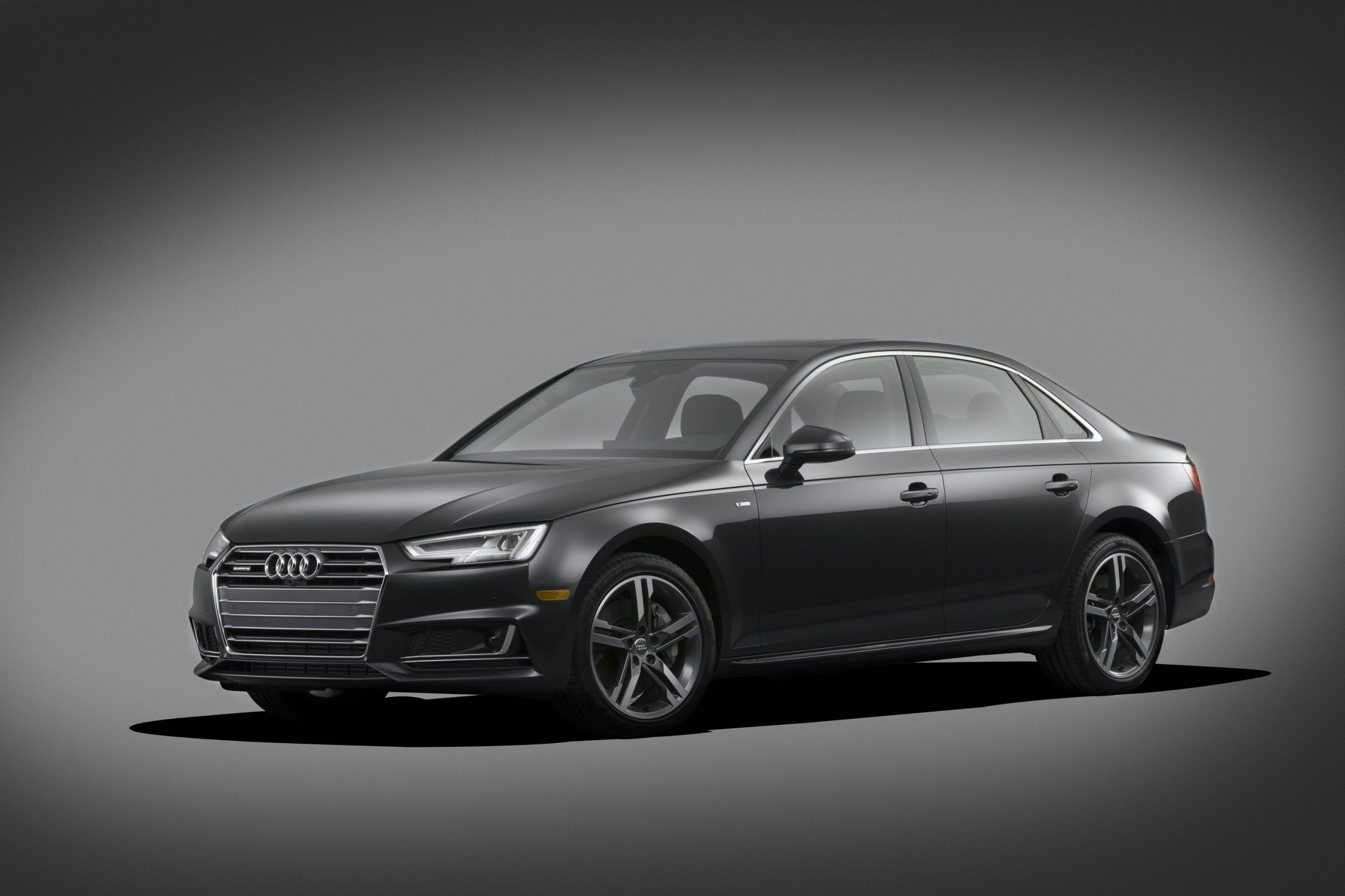 The Audi A4 in grey, a solid certified pre-owned buy, shot from the 3/4 angle in a photo studio