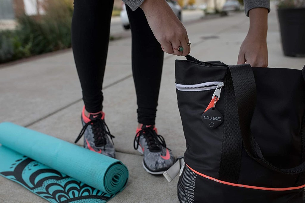 The original Cube Unit attached to a gym bag