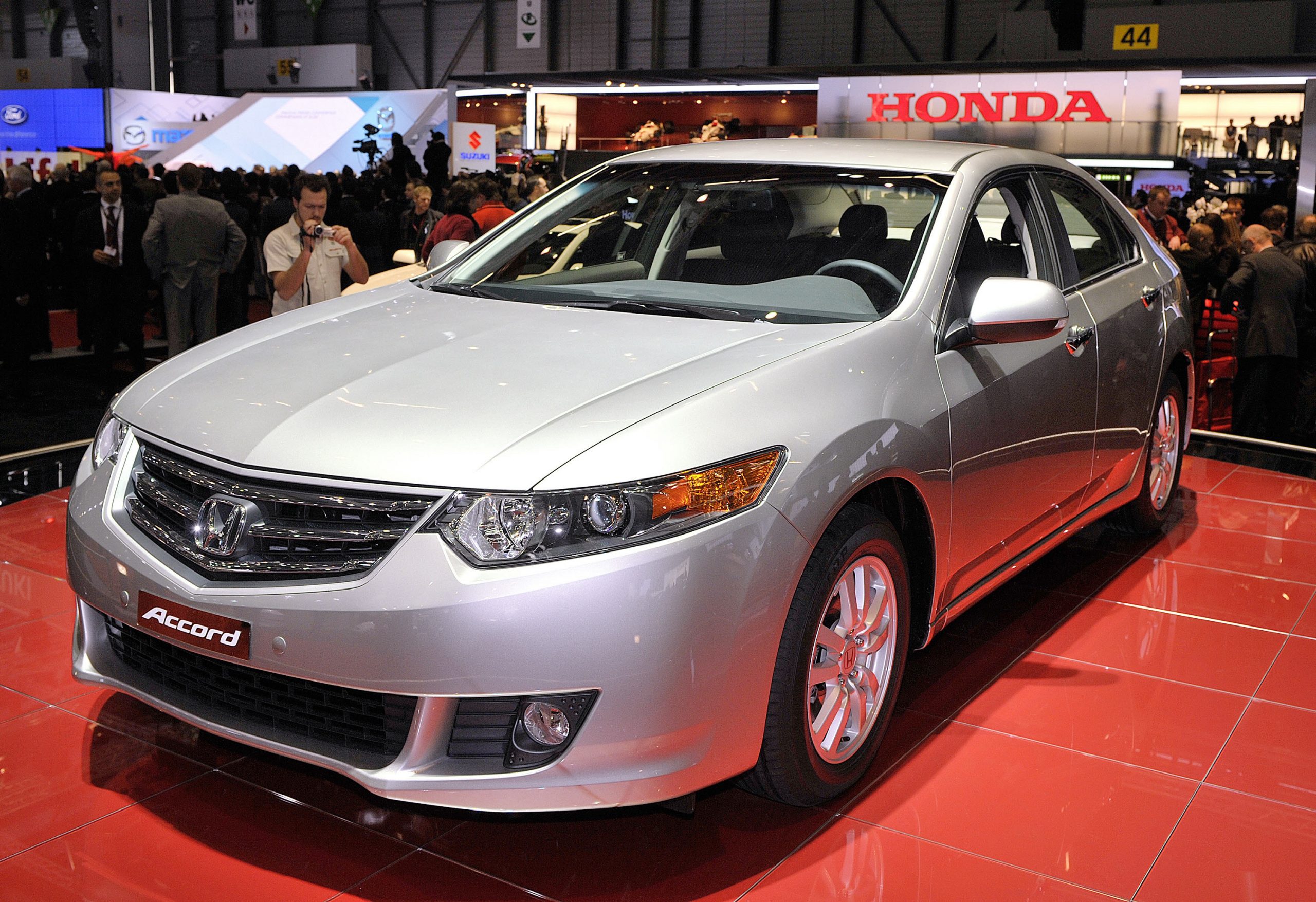 A silver Honda Accord, and excellent used family sedan, shot from the front 3/4 at an auto show