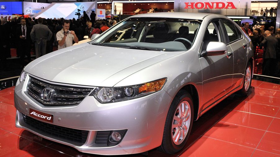A silver Honda Accord, and excellent used family sedan, shot from the front 3/4 at an auto show