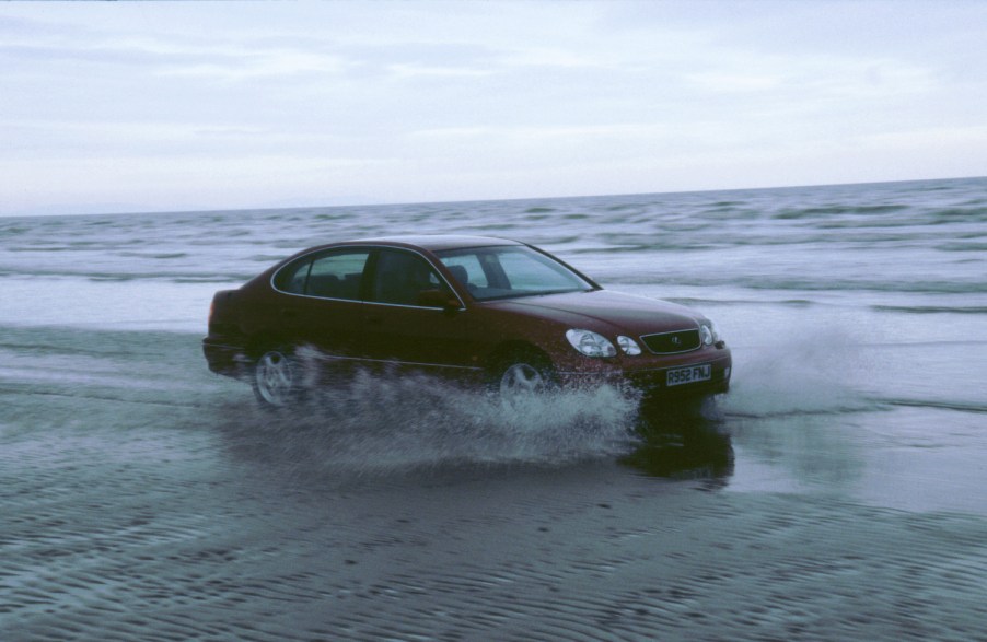 1999 Lexus GS300 driving through sea at Pendine sands, Wales