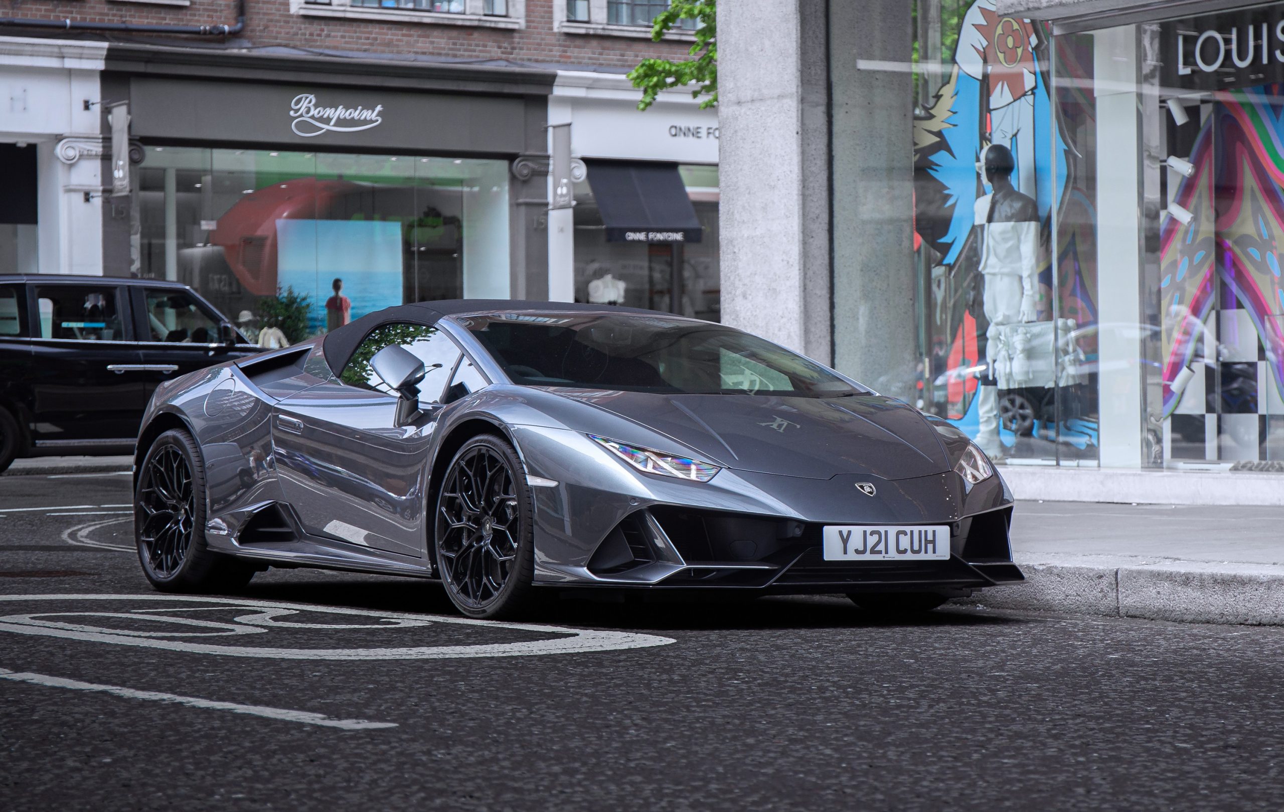 New cars like this grey Lamborghini Huracan, shot from the front 3/4 are heavily discounted for the wealthy