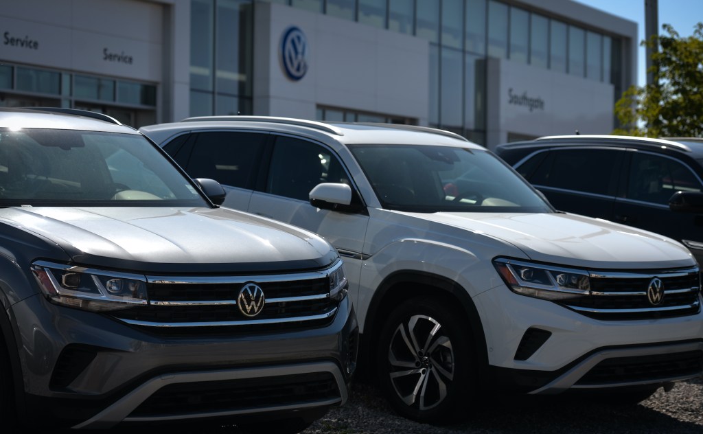 New Volkswagen vehicles parked outside a Volkswagen dealership in South Edmonton.