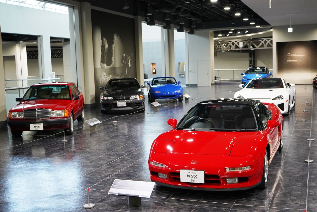 A red first-generation Honda NSX is on display at the Toyota Automobile Museum