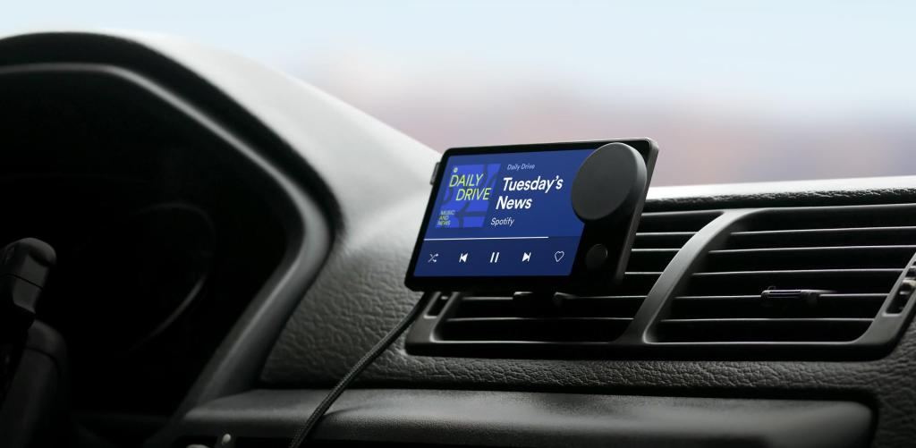 A view of the Spotify Car Thing on a car dashboard. |  Spotify