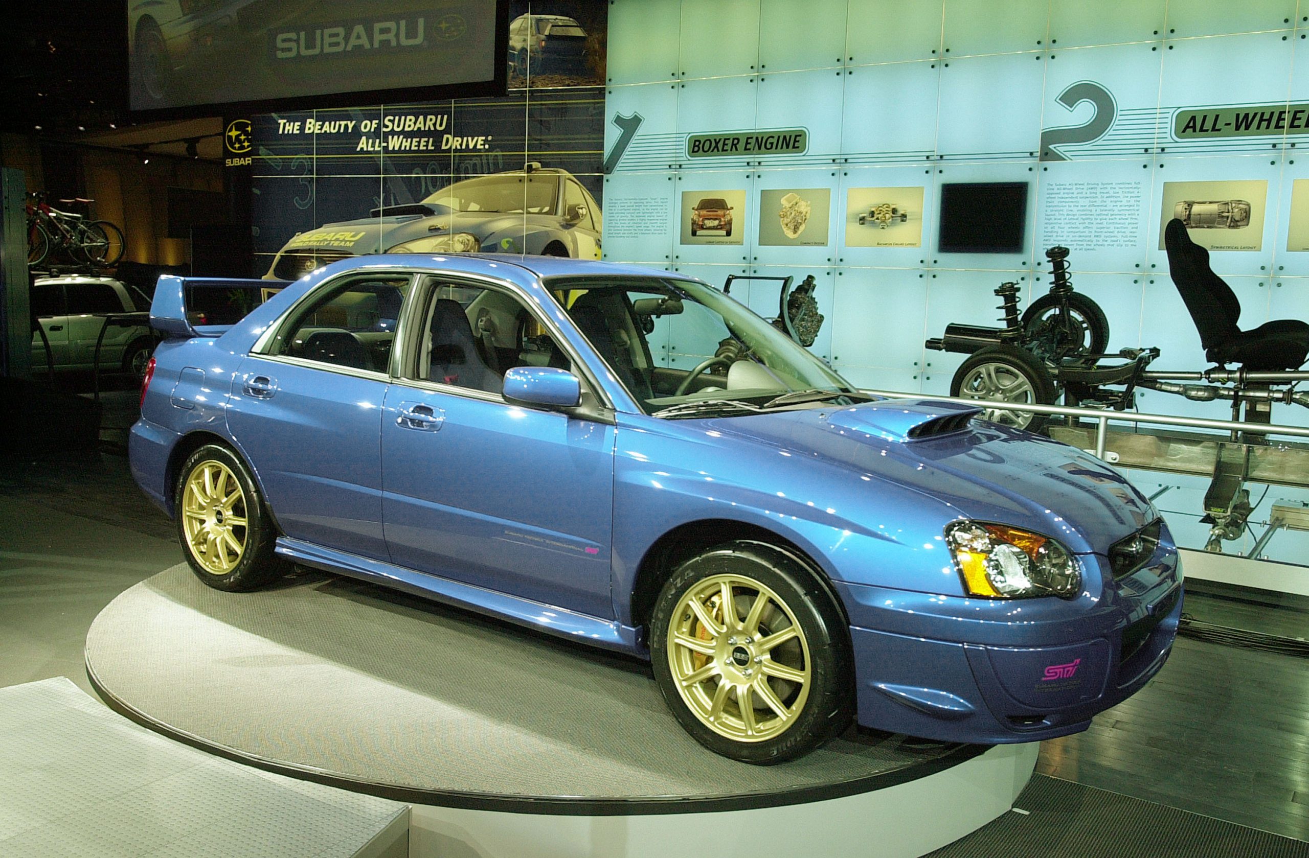 A 2004 Subaru Impreza WRX STI shot from the 3/4 angle at an auto show