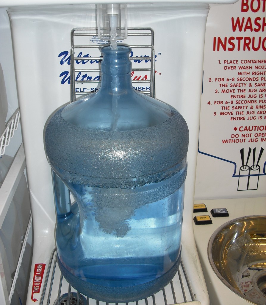 A water jug being filled with water
