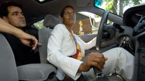 a woman learns how to drive a manual transmission car