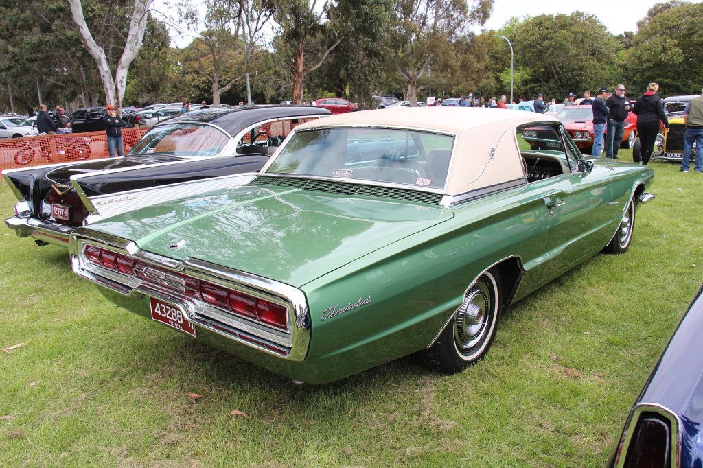 A green Ford Thunderbird with a landau top.