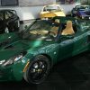 A green 2005 Lotus Elise in a car dealer