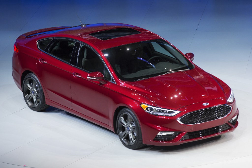 A red 2016 Ford Fusion sedan at NAIAS 2016