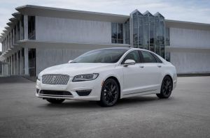 A 2020 Lincoln MKZ midsize luxury sedan model with a white paint color option parked on a concrete lot