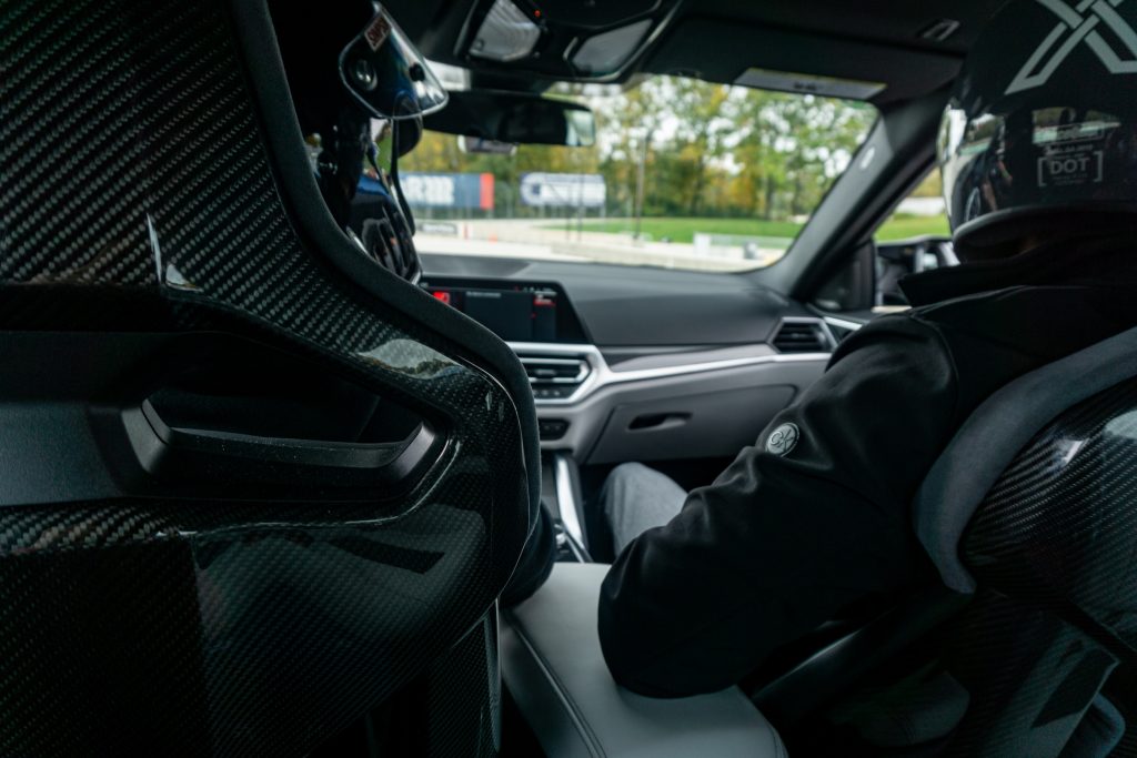 The backseat of a 2021 BMW M4 Competition's carbon bucket seats