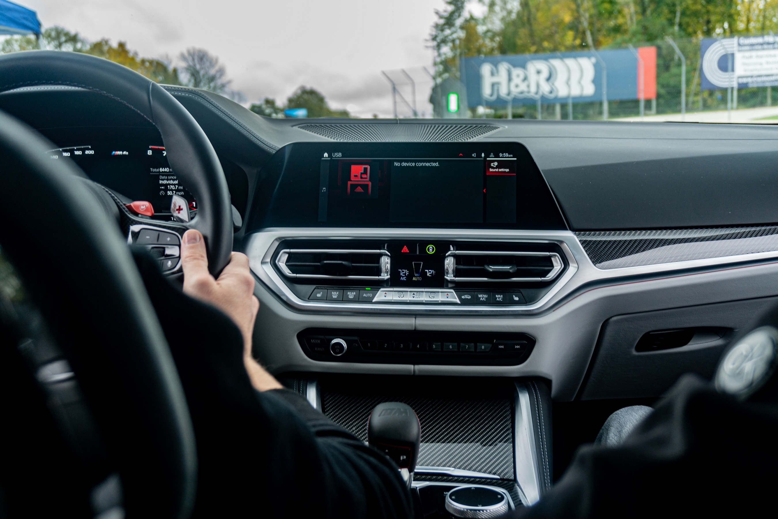 The carbon-fiber-trimmed dashboard of a 2021 BMW M4 Competition