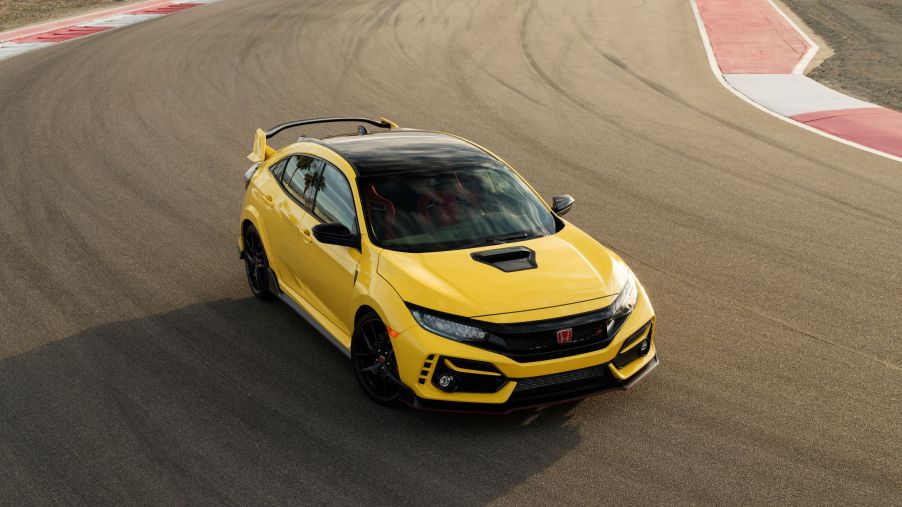 A yellow 2021 Honda Civic Type R with a manual transmission shot from the high 3/4 angle