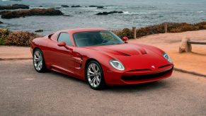 A red 2021 Iso Rivolta GT Zagato by the ocean