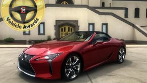 The 2021 Lexus LC 500 in front of a mausoleum with the MotorBiscuit logo