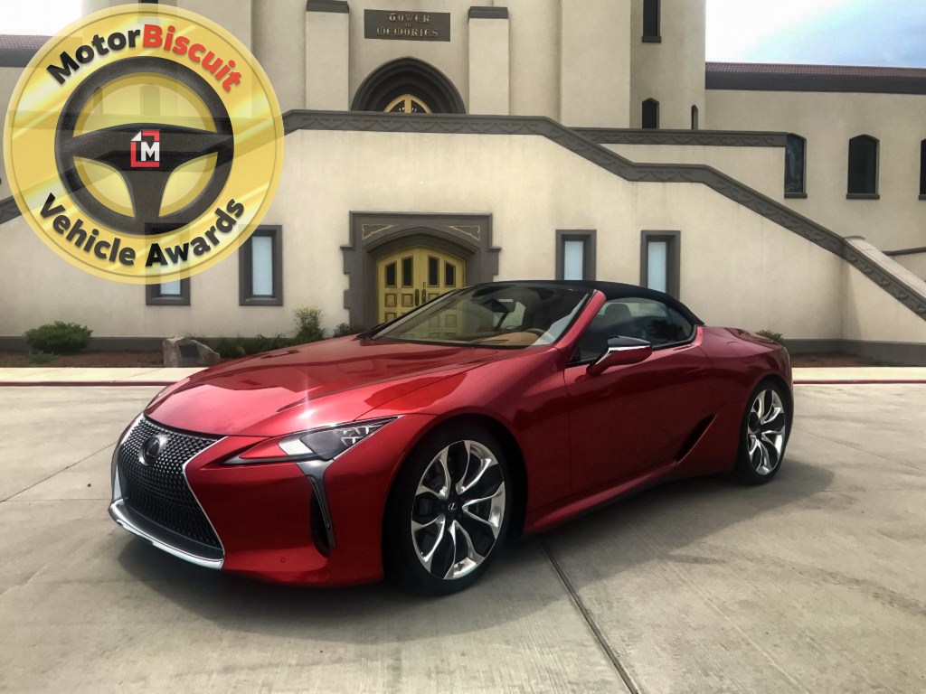 The 2021 Lexus LC 500 in front of a mausoleum with the MotorBiscuit logo