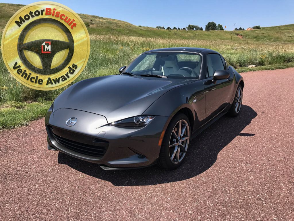 The 2021 Mazda MX-5-Miata in grey with our Car of the Year award Logo