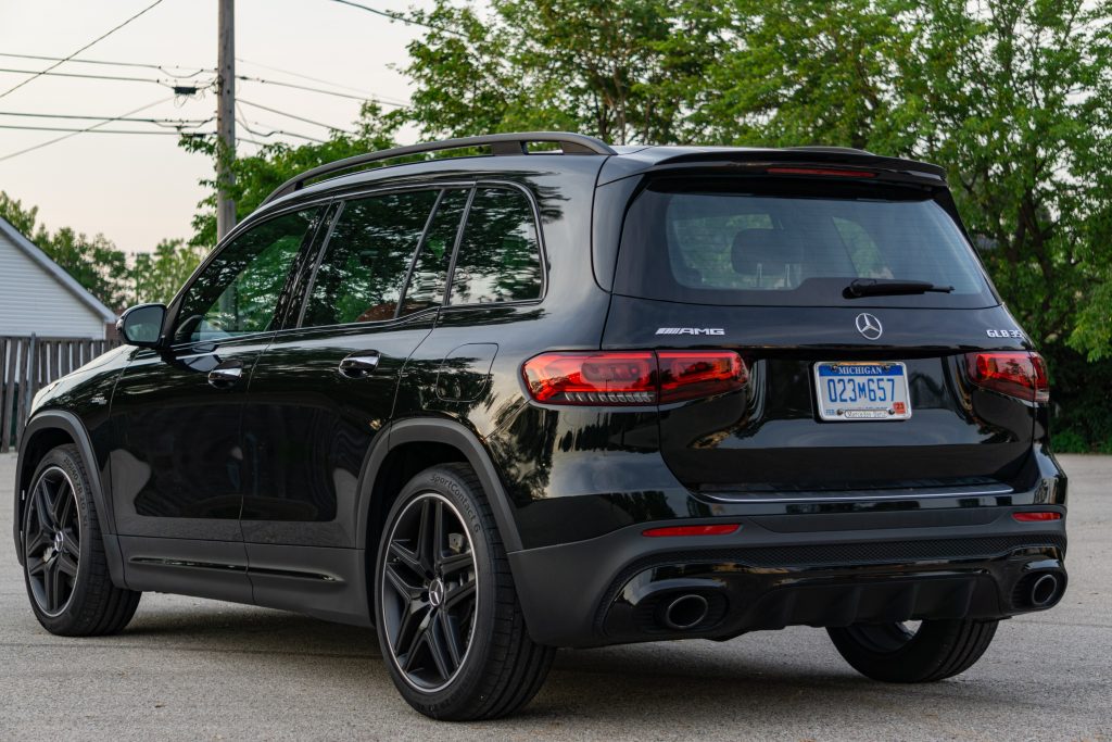 The rear 3/4 view of a black 2021 Mercedes-AMG GLB 35 in a parking lot