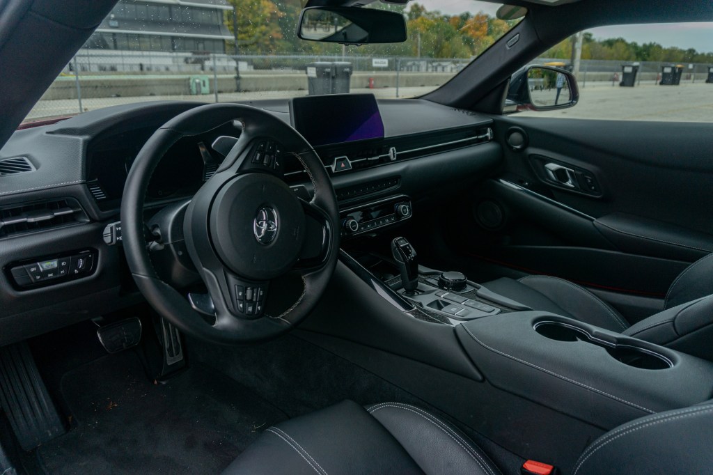 The black-leather-upholstered interior of a 2021 Toyota GR Supra 3.0 Premium