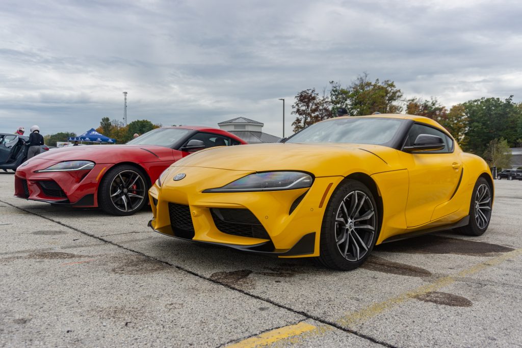 A red 2021 Toyota GR Supra 3.0 Premium next to a yellow 2021 Toyota GR Supra 2.0