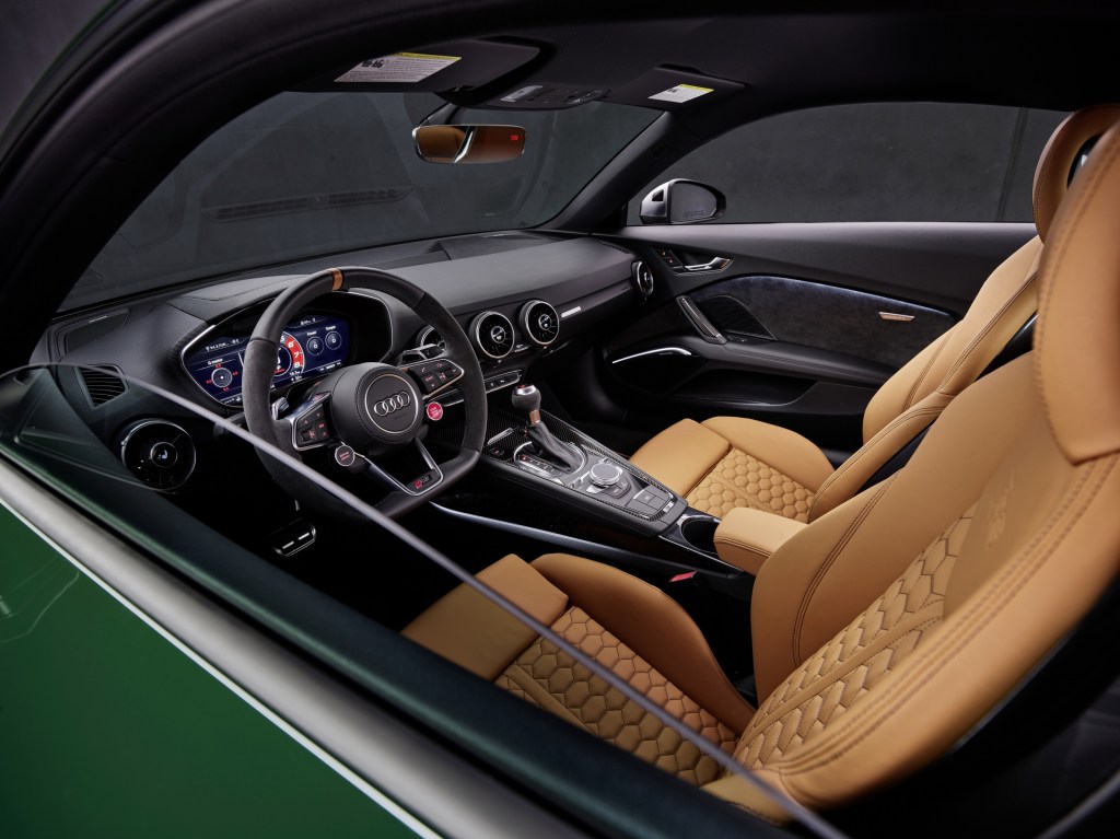 The tan-leather interior and black dashboard of a green 2022 Audi TT RS Heritage Edition