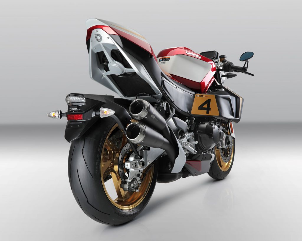 The rear 3/4 view of a red-white-and-black 2022 Bimota KB4 RC