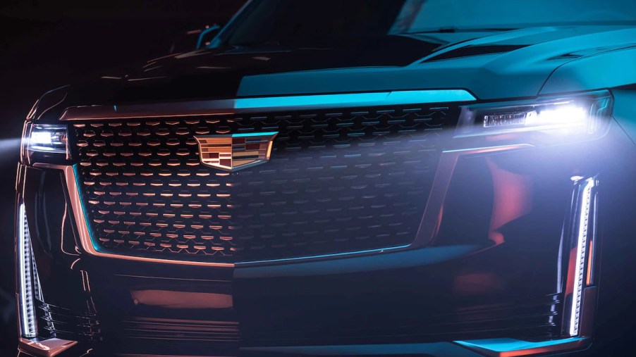A black 2022 Cadillac Escalade front grille with LED headlights turned on, is it worth more than $100,000?