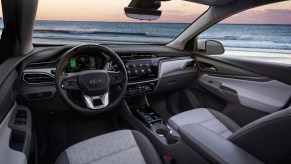 A 2022 Chevy Bolt EUV's cockpit overlooking a large body of water
