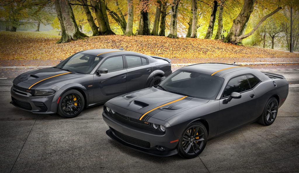 2022 Dodge Challenger GT RWD (near) and 2022 Dodge Charger Scat Pack Widebody, with HEMI® Orange appearance package