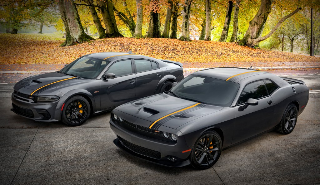 2022 Dodge Challenger GT RWD (near) and 2022 Dodge Charger Scat Pack Widebody, with HEMI® Orange appearance package