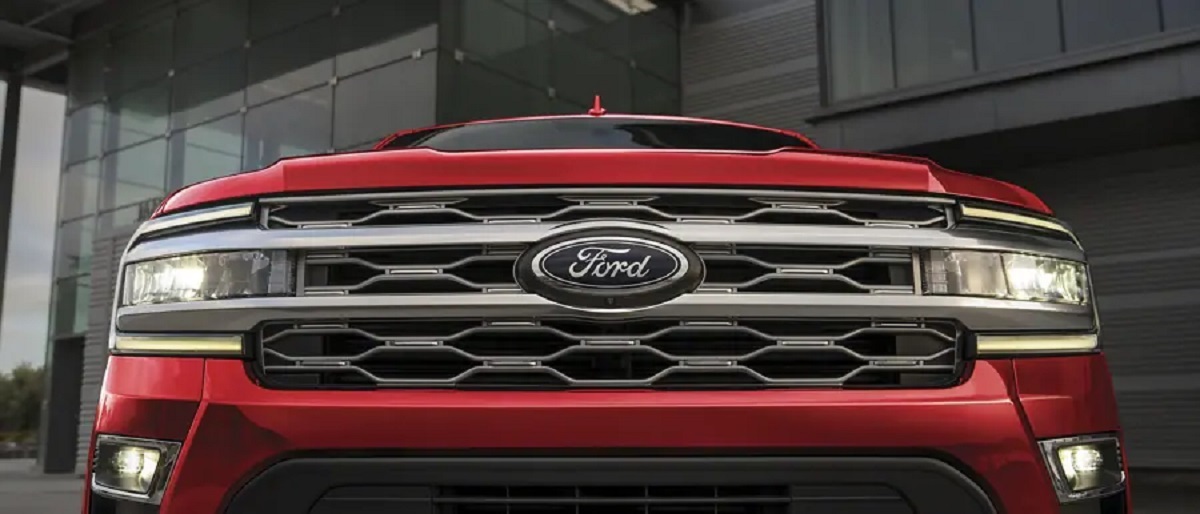 The front grille of a red 2022 Ford Expedition Max.