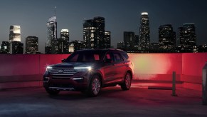 2022 Ford Explorer King Ranch parked with a city background at night with the lights on, is it really worth $54K?
